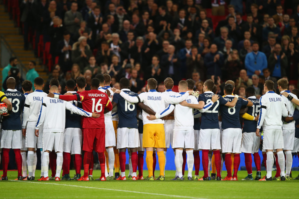 LONDON, ENGLAND - NOVEMBER 17:  Both teams stand together for a moment of applause prior to the International Friendly match between England and France at Wembley Stadium on November 17, 2015 in London, England.  (Photo by Clive Rose/Getty Images)