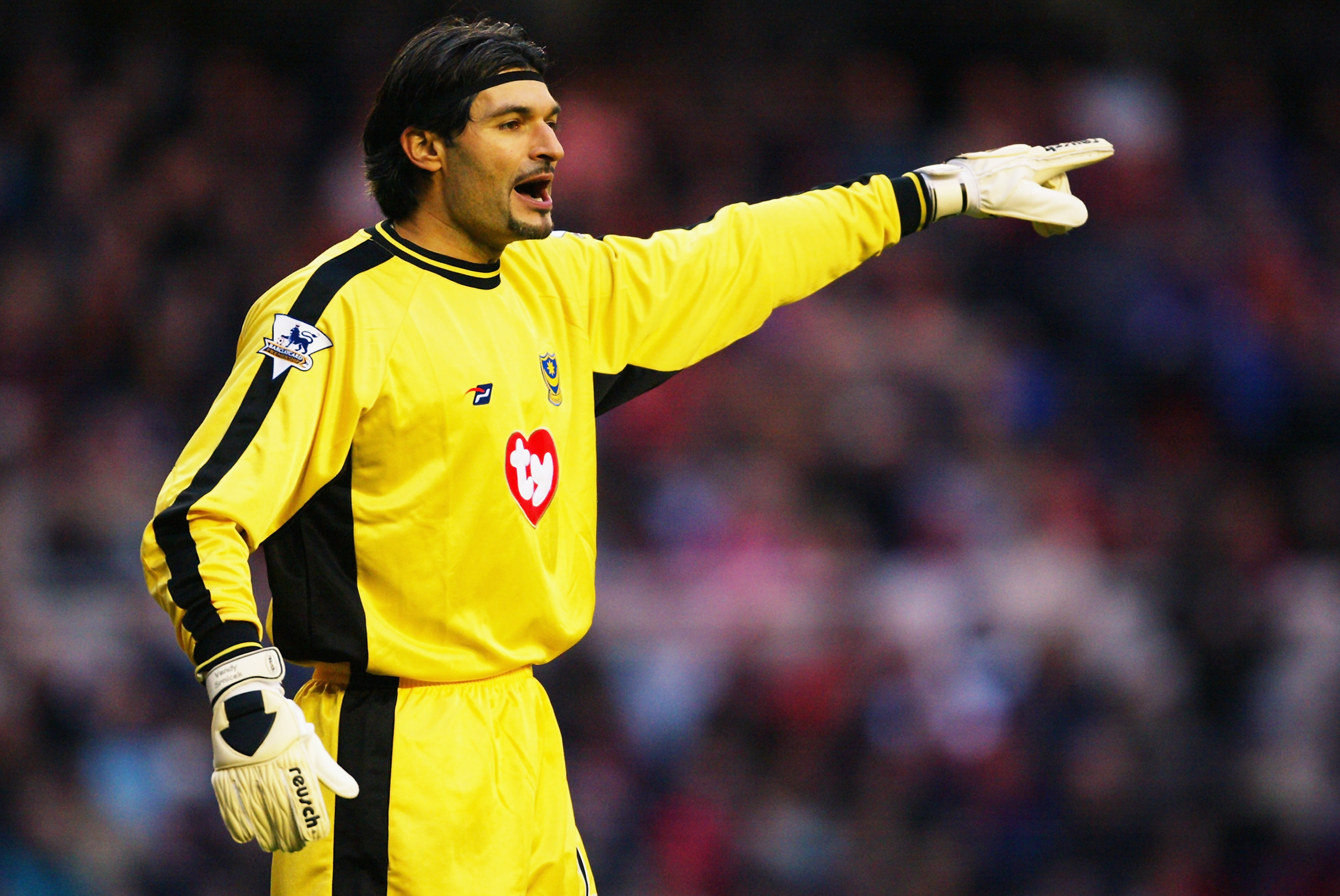 Pavel Srnicek of Portsmouth signals to a team mate
