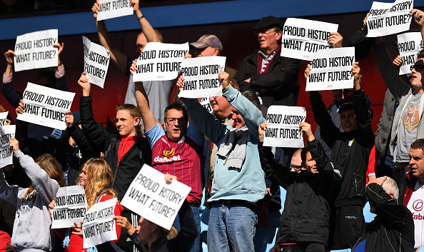 BIRMINGHAM, ENGLAND - APRIL 02: Aston Villa supporters hold banners during the Barclays Premier League match between Aston Villa and Chelsea at Villa Park on April 2, 2016 in Birmingham, England. (Photo by Shaun Botterill/Getty Images)