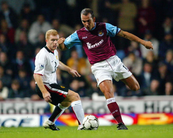 Paolo Di Canio of West Ham United and Paul Scholes of Manchester United