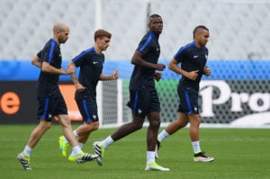PARIS, FRANCE - JUNE 09: (L to R) Christophe Jallet, Antoine Griezmann, Paul Pogba and Dimitri Payet of France warm up during training session ahead of the UEFA EURO 2016 Group A match between France and Romania at Stade de France on June 9, 2016 in Paris, France. France and Romania will contest the opening match of the tournament on June 10. (Photo by Matthias Hangst/Getty Images)