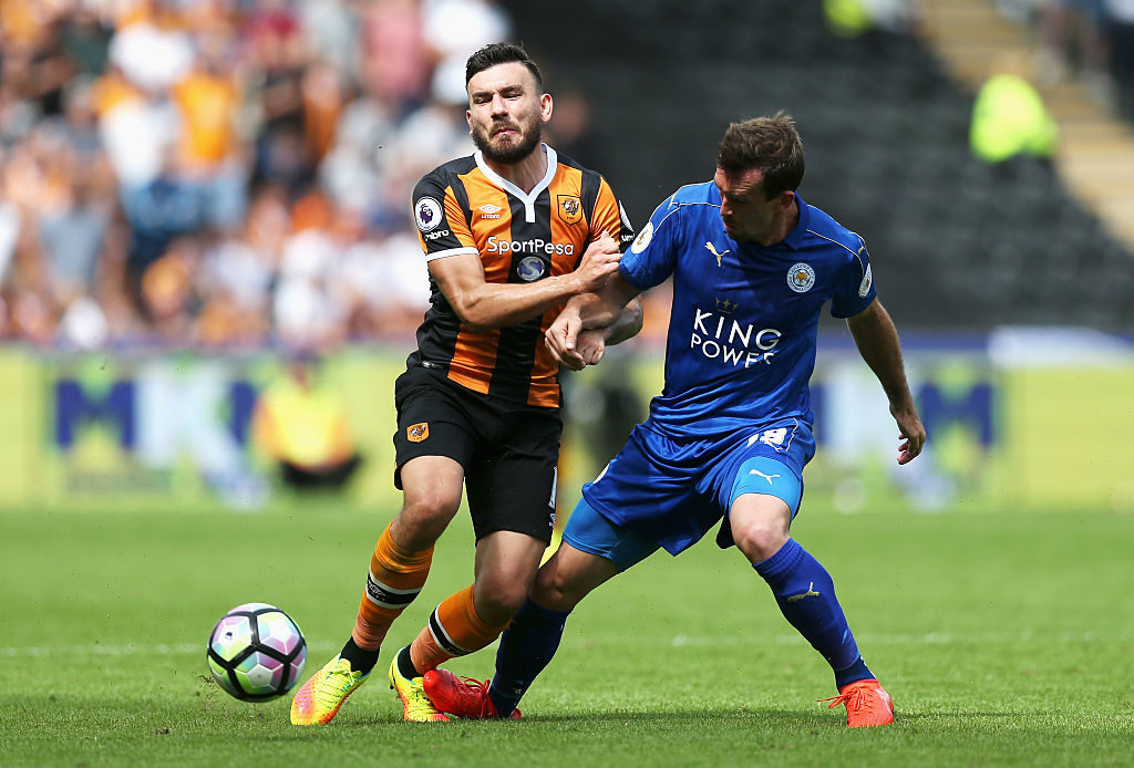 HULL, ENGLAND - AUGUST 13:  Robert Snodgrass of Hull City and Christian Fuchs of Leicester City battle for possession during the Premier League match between Hull City and Leicester City at KCOM Stadium on August 13, 2016 in Hull, England.  (Photo by Alex Morton/Getty Images)