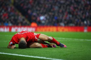 LIVERPOOL, ENGLAND - NOVEMBER 26:  Philippe Coutinho of Liverpool lies injured during the Premier League match between Liverpool and Sunderland at Anfield on November 26, 2016 in Liverpool, England.  (Photo by Clive Brunskill/Getty Images)