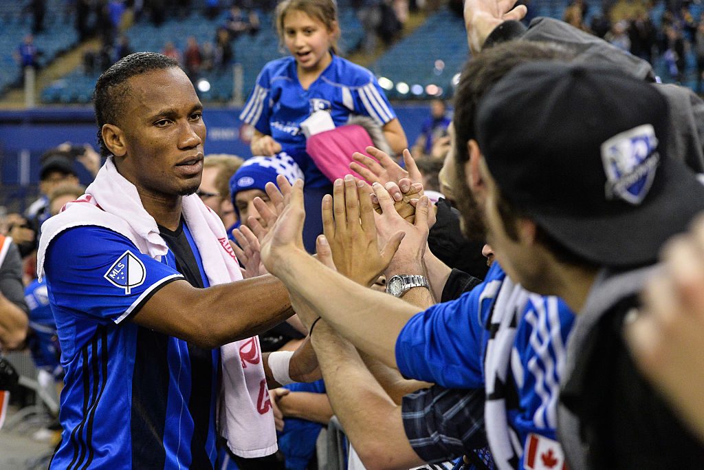 MONTREAL, QC - NOVEMBER 22:  Didier Drogba #11 of the Montreal Impact celebrates with fans during leg one of the MLS Eastern Conference finals against the Toronto FC at Olympic Stadium on November 22, 2016 in Montreal, Quebec, Canada.  The Montreal Impact defeated the Toronto FC 3-2.  (Photo by Minas Panagiotakis/Getty Images)