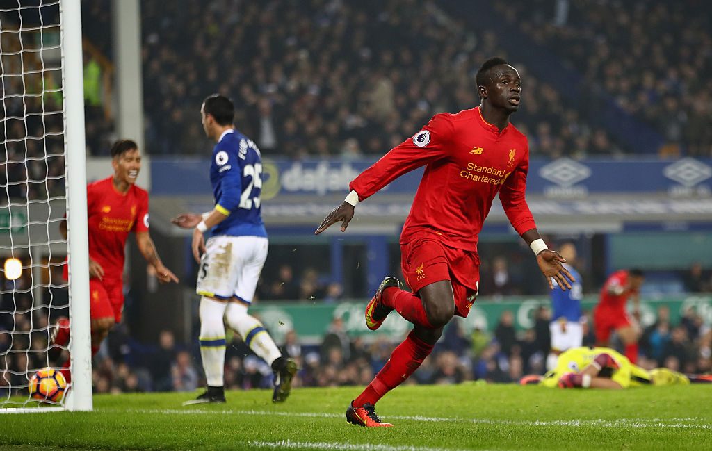 LIVERPOOL, ENGLAND - DECEMBER 19:  Sadio Mane (19) of Liverpool celebrates after scoring the winning goal in injury time during the Premier League match between Everton and Liverpool at Goodison Park on December 19, 2016 in Liverpool, England.  (Photo by Clive Brunskill/Getty Images)