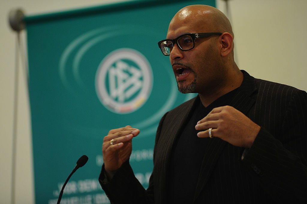 HENNEF, GERMANY - JANUARY 17: Former NBA player John Amaechi holds a speach during the DFB Dialog Forum 'Vor dem Ball sind alle gleich - Sexuelle Identitaeten im Fussball' about sexual identities in football at Sportschule Hennef on January 17, 2012 in Hennef, Germany. (Photo by Dennis Grombkowski/Bongarts/Getty Images)