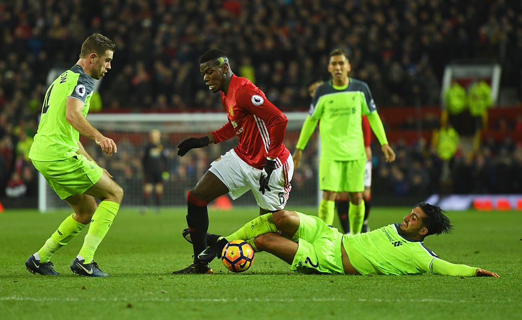 MANCHESTER, ENGLAND - JANUARY 15: Paul Pogba of Manchester United takes on Emre Can and Jordan Henderson of Liverpool during the Premier League match between Manchester United and Liverpool at Old Trafford on January 15, 2017 in Manchester, England. (Photo by Mike Hewitt/Getty Images)