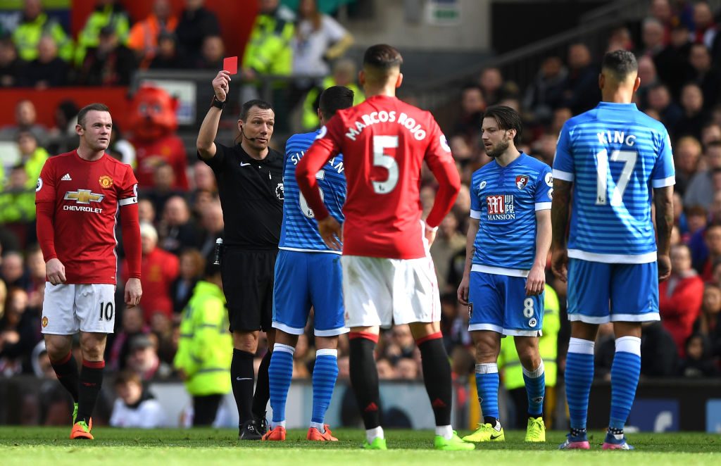 MANCHESTER, ENGLAND - MARCH 04: Andrew Surman of AFC Bournemouth (C) is shown a red card by referee Kevin Friend (L) during the Premier League match between Manchester United and AFC Bournemouth at Old Trafford on March 4, 2017 in Manchester, England. (Photo by Shaun Botterill/Getty Images)