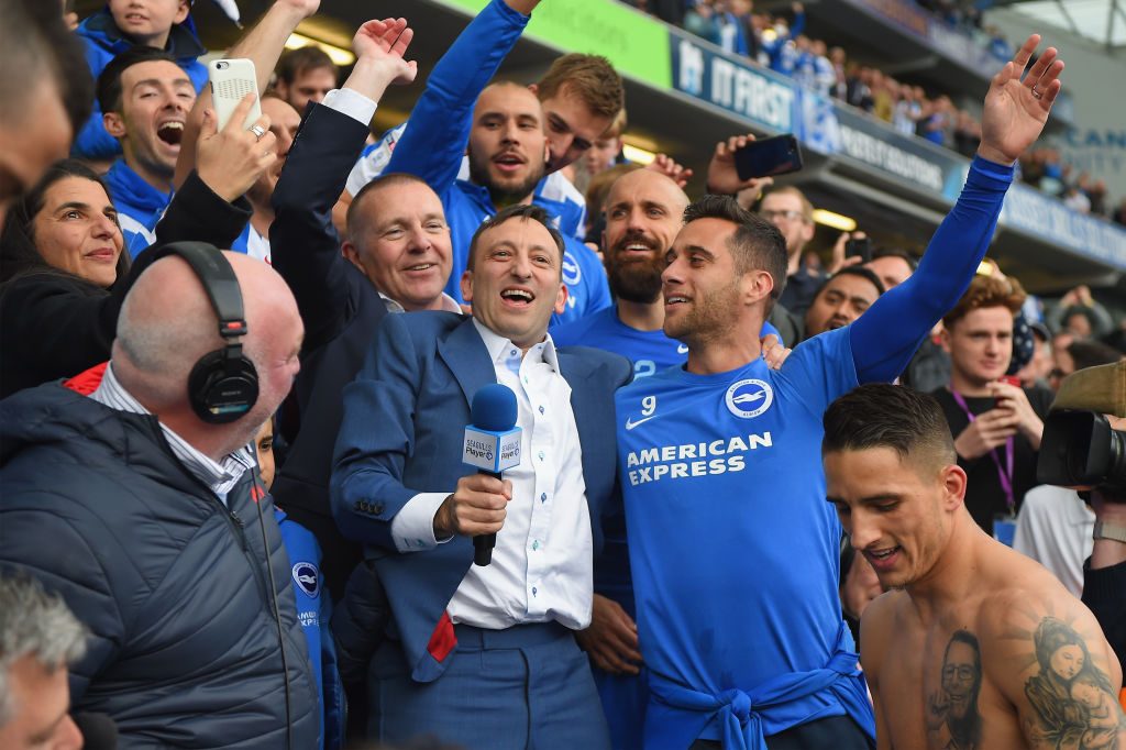 BRIGHTON, ENGLAND - APRIL 17:  Brighton chairman Tony Bloom (with microphone) celebrates with players at the end of the Sky Bet Championship match between Brighton & Hove Albion and Wigan Athletic at Amex Stadium on April 17, 2017 in Brighton, England.  (Photo by Mike Hewitt/Getty Images)