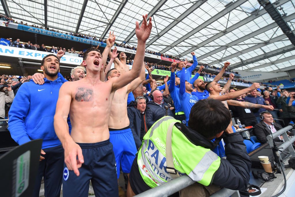BRIGHTON, ENGLAND - APRIL 17:  Brighton players including Lewis Dunk (L) celebrate with the fans after  the Sky Bet Championship match between Brighton & Hove Albion and Wigan Athletic at Amex Stadium on April 17, 2017 in Brighton, England.  (Photo by Mike Hewitt/Getty Images)