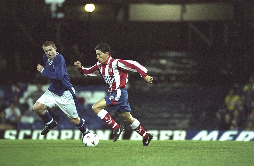 30 Sep 1997: Juninho of Atletico Madrid goes past Neil Lennon of Leicester City during the UEFA Cup first round second leg match at Filbert Street in Leicester, England. Madrid won 2-0 on the night and 4-1 on aggregate. Mandatory Credit: Graham Chadwick /Allsport