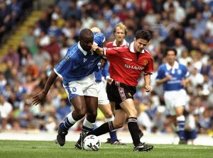 Dele Adebola of Birmingham City is tackled by Phil Mulryne of Manchester United