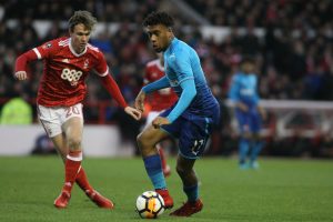 Alex Iwobi looks to get away from Forest’s Kieron Dowell