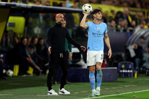 getty_GuardiolaPepStonesJohn20221026