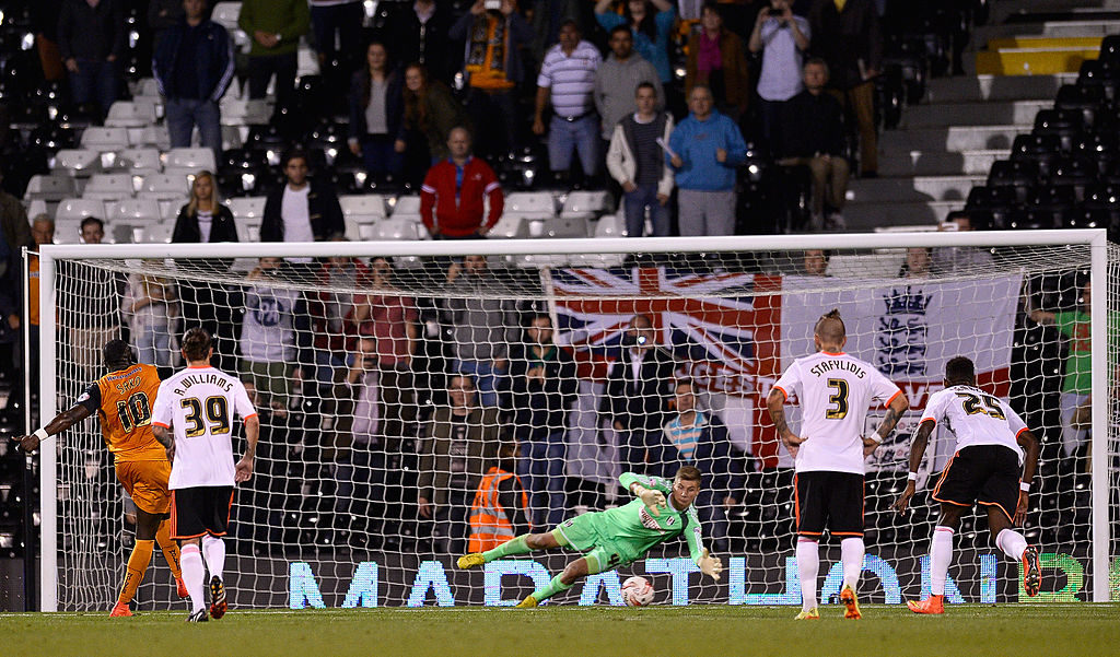 LONDON, ENGLAND - AUGUST 20: Bakary Sako Of Wolverhampton Wanderers sees his penalty saved by Jesse Joronen of Fulham during the Sky Bet Championship match between Fulham and Wolverhampton Wanderers at Craven Cottage on August 20, 2014 in London, England. (Photo by Justin Setterfield/Getty Images)