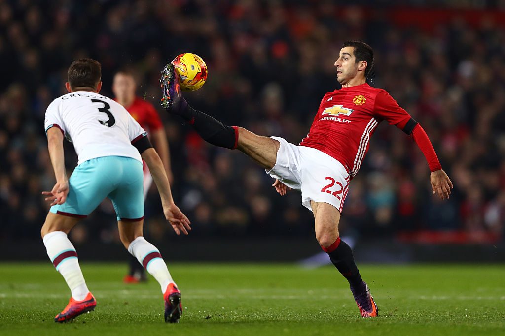 MANCHESTER, ENGLAND - NOVEMBER 30: Henrikh Mkhitaryan of Manchester United controls the ball ahead of Aaron Cresswell of West Ham United during the EFL Cup quarter final match between Manchester United and West Ham United at Old Trafford on November 30, 2016 in Manchester, England.  (Photo by Michael Steele/Getty Images)